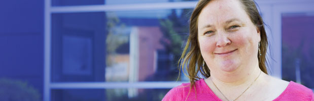 Brenda standing in front of the Salt Lake Community College